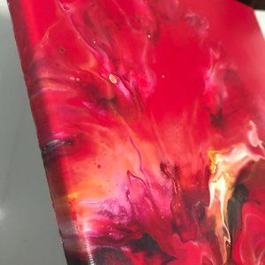 Vibrant, red dutch pour fluid art painting.
